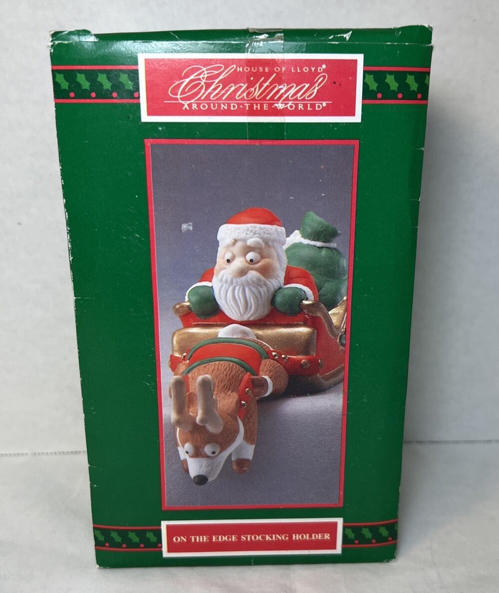 1991 HOUSE OF LLOYD On The Edge Stocking Holder Christmas Around The World Santa